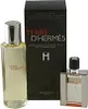 A gift set of Terre D'Hermes perfume, including a large bottle and a smaller travel spray, next to its packaging. Podgląd zdjęcia produktu