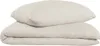 A folded duvet and a pillow, both in a light taupe color, are stacked on a white background. Produktbild-Vorschau