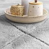 A close-up view of a rug with decorative items on a tray placed on it. Anteprima dell’immagine prodotto