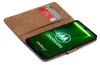 A book-style phone case with cards inserted, displaying a smartphone screen with the Motorola logo and branding. Náhľad obrázku produktu