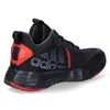 A side view of a black Adidas sneaker with red accents. Podgląd zdjęcia produktu
