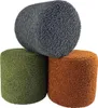 Three bouclé-covered ottomans are stacked on a white background. Produktbild-Vorschau