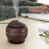 A person is working on a laptop on a desk with a humidifier in the foreground. Produktbild-Vorschau