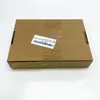 A cardboard box with a label on it, placed on a white surface. Produktbild-Vorschau
