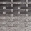 A close-up, full-frame shot of a woven outdoor bench made of poly rattan. Produktbild-Vorschau