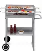 A silver charcoal grill with food on the grates, two bottles of sauce, and a bowl of olives on the lower shelf, set against a white background. Náhľad obrázku produktu