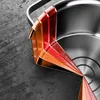 A close-up, angled view of a multi-layered material, likely representing the construction of a pot, set against a textured gray and black background. Náhled obrázku produktu