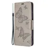 A gray flip phone case with a butterfly design. Produktbild-Vorschau