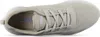 A top-down view of a beige Skechers sneaker. Voir les images du produit