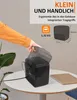 A hand is shown lifting a black portable heater on a white table, with a laptop and plant in the background. Text overlays highlight product features. Produktbild-Vorschau