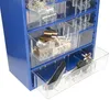 A close-up view of a blue storage cabinet with multiple clear drawers filled with various hardware and tools. Produktbild-Vorschau