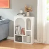 A white shelving unit with decorative items and books, placed next to a sofa and a window with curtains. Anteprima dell’immagine prodotto