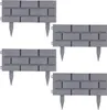 Four grey plastic garden edging pieces designed to look like brickwork, arranged in a grid. Produktbild-Vorschau