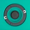 A close-up view of a dial with numbers on a teal background. Produktbild-Vorschau