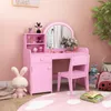 A pink vanity set for children, including a desk with a mirror, a chair, and storage compartments, placed in a room with pink walls and a rug. Podgląd zdjęcia produktu
