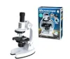 A white microscope and its packaging are displayed against a white background. Voir les images du produit