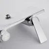 A close-up shot of a chrome shower faucet with a white dial. Produktbild-Vorschau