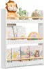 A white three-tiered bookshelf filled with children's books and stuffed toys. Náhled obrázku produktu