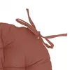 A close-up of a round seat cushion with ties. Produktbild-Vorschau