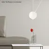 A minimalist interior scene with a grey sofa, a white table, a vase with a red flower, and a white router mount on the wall. Náhled obrázku produktu