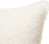 A close-up view of a textured, ivory-colored pillow. Náhled obrázku produktu
