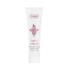 A white tube of hand cream with red text and a decorative pattern. Produktbild-Vorschau