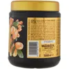 A close-up of a black jar with a gold lid, featuring an illustration of argan fruits and leaves on the side, along with product information text and a barcode. Produktbild-Vorschau