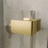 A close-up view of a gold shower handle and part of a shower cabin. Produktbild-Vorschau