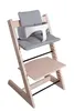 A high chair with cushions and a safety harness, shown against a white background. Voir les images du produit