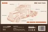 The image shows the packaging of a ROKR Heavy Truck 3D wooden puzzle. It features a detailed illustration of the truck with various parts labeled. Náhľad obrázku produktu