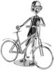 A metal figurine of a person with a bicycle, made from nuts, bolts, and other metal parts. Náhľad obrázku produktu
