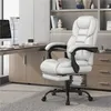A white ergonomic office chair with a footrest is shown in a modern office setting, next to a wooden desk with a computer. Produktbild-Vorschau