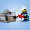 A Lego figure wearing a hard hat and safety vest is using a red tool to interact with a Lego construction. Produktbild-Vorschau