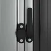 A close-up view of a black latch mechanism on a silver metal surface. Produktbild-Vorschau