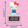 A pink digital alarm clock with a Hello Kitty figure on top, featuring dimensions indicated by arrows and text. Podgląd zdjęcia produktu