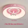 A pink ceiling light with a unicorn decoration, shown mounted on a ceiling. Produktbild-Vorschau