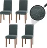 Four dining chairs are arranged in a studio setting with a magnified view of the fabric texture. Náhľad obrázku produktu