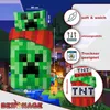 A Minecraft-themed bedding set featuring a Creeper and TNT design, displayed in a stylized, game-like environment with characters. Podgląd zdjęcia produktu