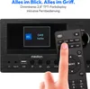A close-up of a MEDION micro audio system with a hand holding a remote control pointing at the screen. Produktbild-Vorschau