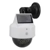 A white and black solar-powered security camera dummy with a blinking LED light. Produktbild-Vorschau