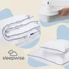 A collage of bedding products, including a folded duvet, pillows, and a fitted sheet being put on a mattress, with the brand logo and name. Produktbild-Vorschau