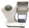 A white electric cheese grater with a clear plastic container for grated food. Anteprima dell’immagine prodotto