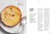 A page from a cookbook showing a recipe for a lemon tart. Produktbild-Vorschau