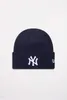 A navy blue New Era NY Yankees beanie is shown against a white background. Podgląd zdjęcia produktu