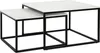 A set of two nesting coffee tables with white tops and black metal frames, shown against a white background. Voir les images du produit
