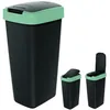 A product shot of a black trash can with a green rim and lid, shown from multiple angles. Anteprima dell’immagine prodotto