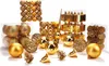 A collection of gold-colored Christmas ornaments and tree toppers arranged on a white background. Náhled obrázku produktu