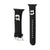 Two black watch straps with cartoon-like figures on them, displayed against a white background. Voir les images du produit