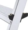 Close-up view of the connection point between a step and the side rail of an aluminum ladder. Produktbild-Vorschau