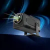 A black projector with light beams emanating from the lens, set against a dark blue and black background with abstract blue light trails. Náhľad obrázku produktu